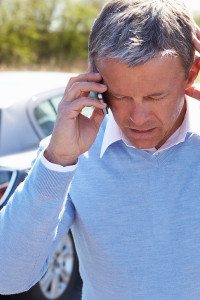Man on Phone Discussing Lawsuit After an Automobile Accident